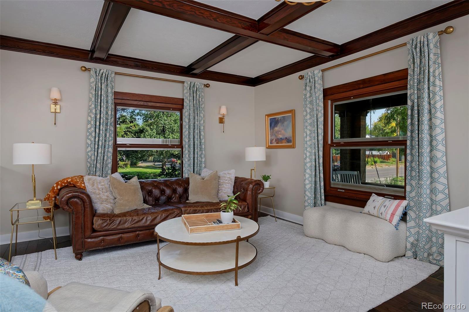 2591 Ash Street Denver, CO 80207 - Photo 8 of 48 a living room with furniture and a large window