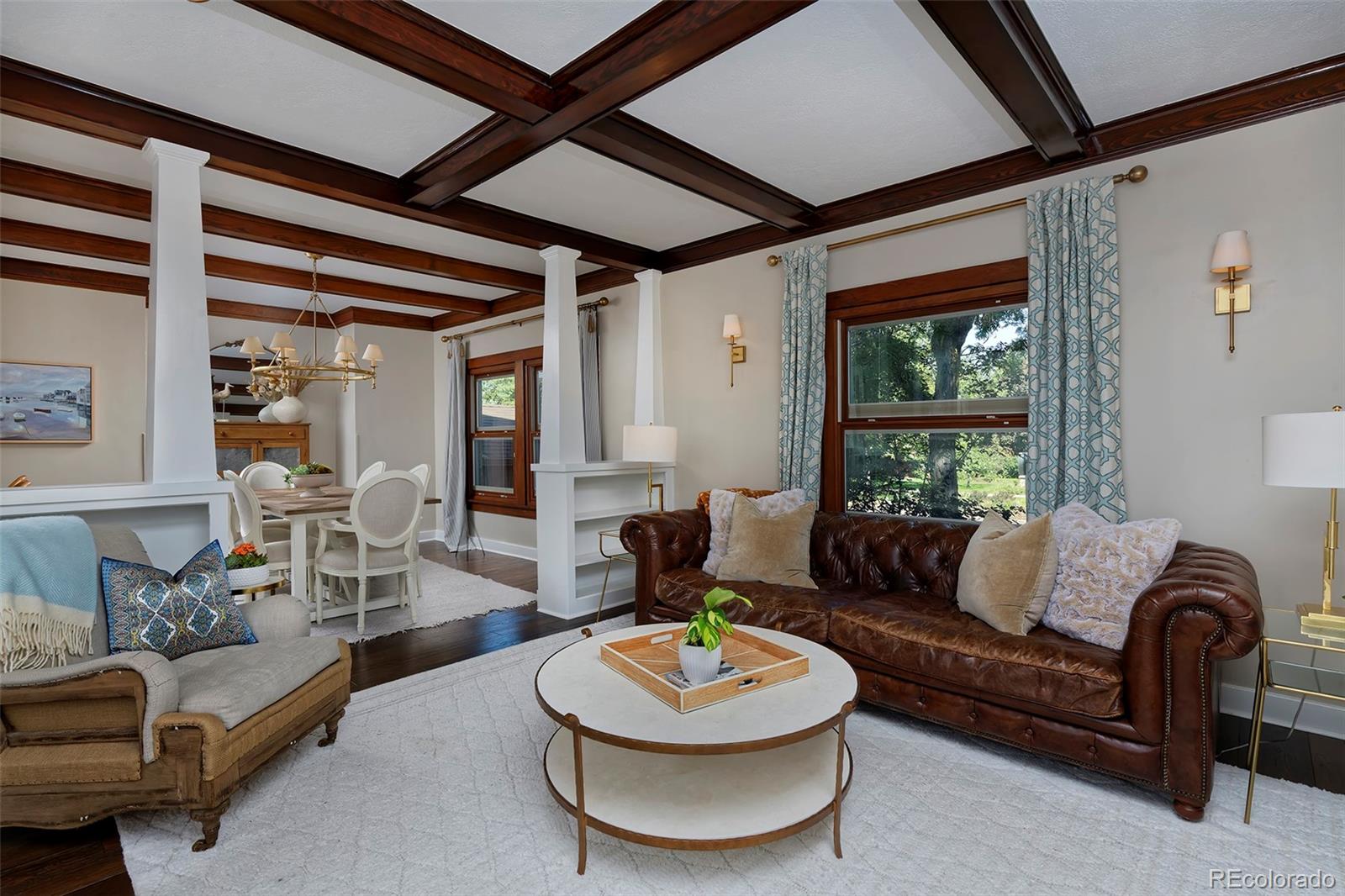 2591 Ash Street Denver, CO 80207 - Photo 9 of 48 a living room with furniture and a large window
