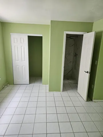 a view of a porch with wooden floor