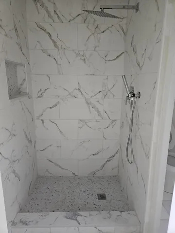 a view of a room with a sink and cabinets