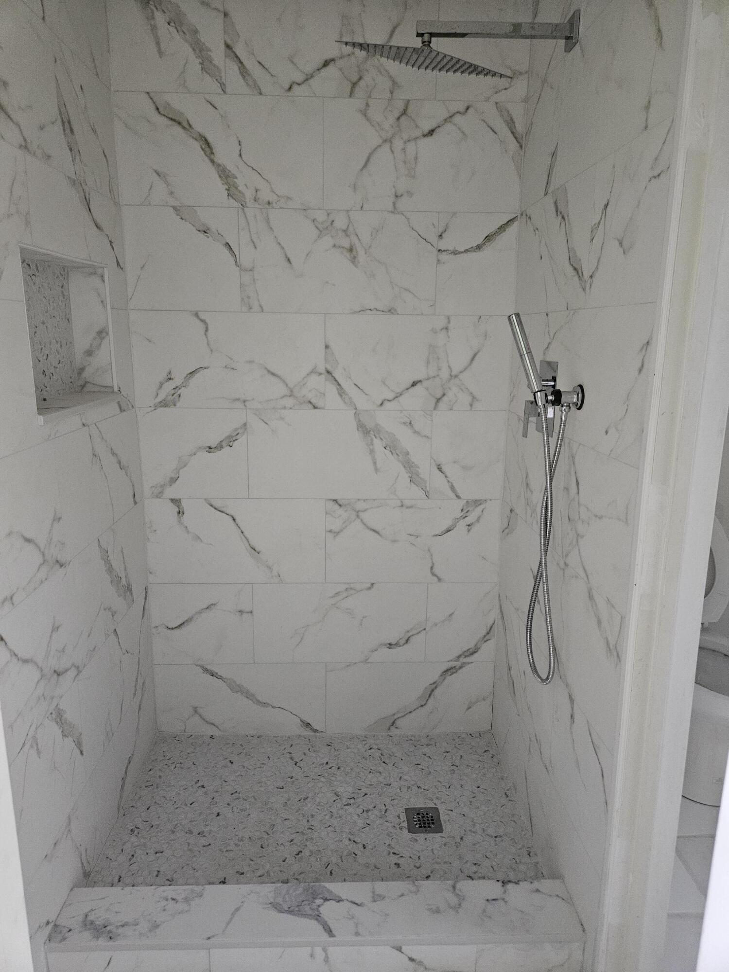 21109 Northeast 3rd Court Miami, FL 33179 - Photo 14 of 30 a bathroom with a shower