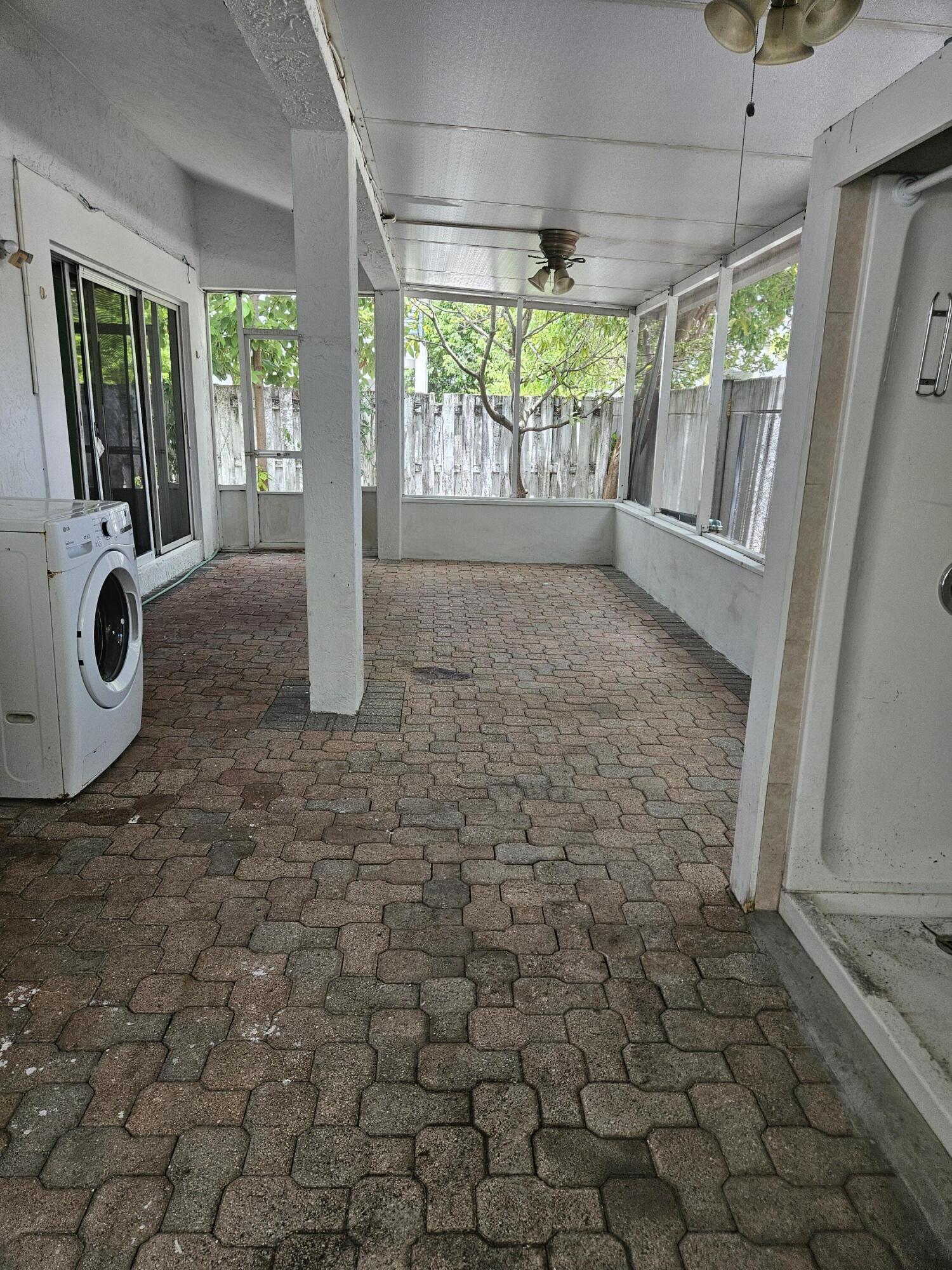 21109 Northeast 3rd Court Miami, FL 33179 - Photo 15 of 30 a view of a porch with wooden floor