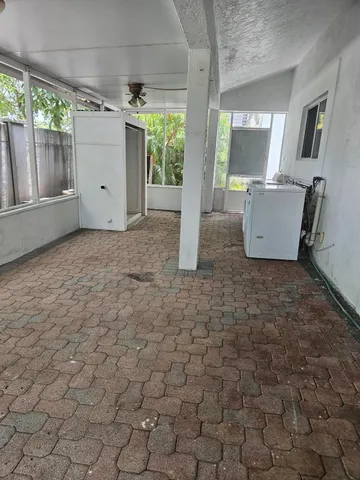 a kitchen with a refrigerator and a sink