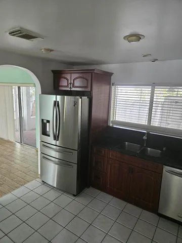 a view of room with window and wooden floor