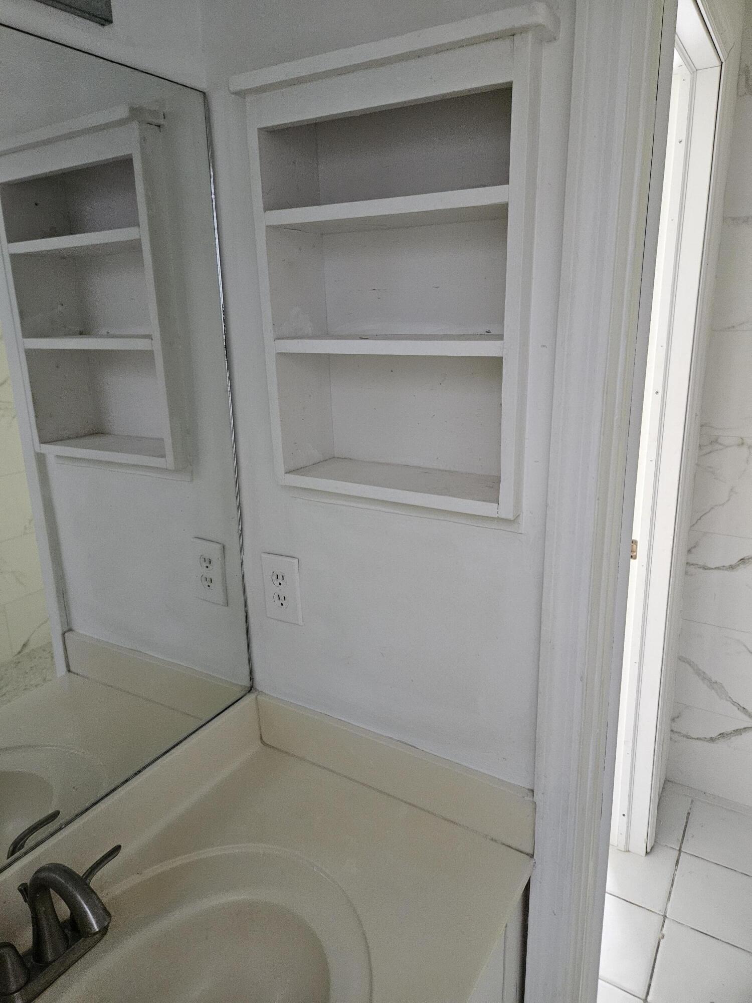 21109 Northeast 3rd Court Miami, FL 33179 - Photo 19 of 30 a bathroom with a bathtub