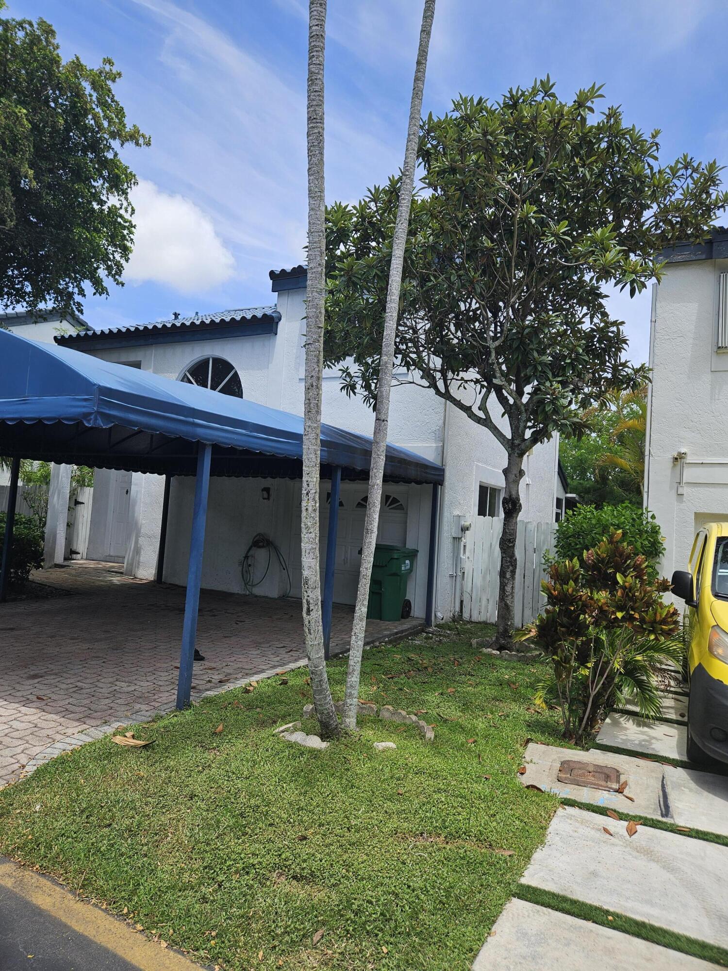 21109 Northeast 3rd Court Miami, FL 33179 - Photo 2 of 30 a view of a house with backyard and a tree