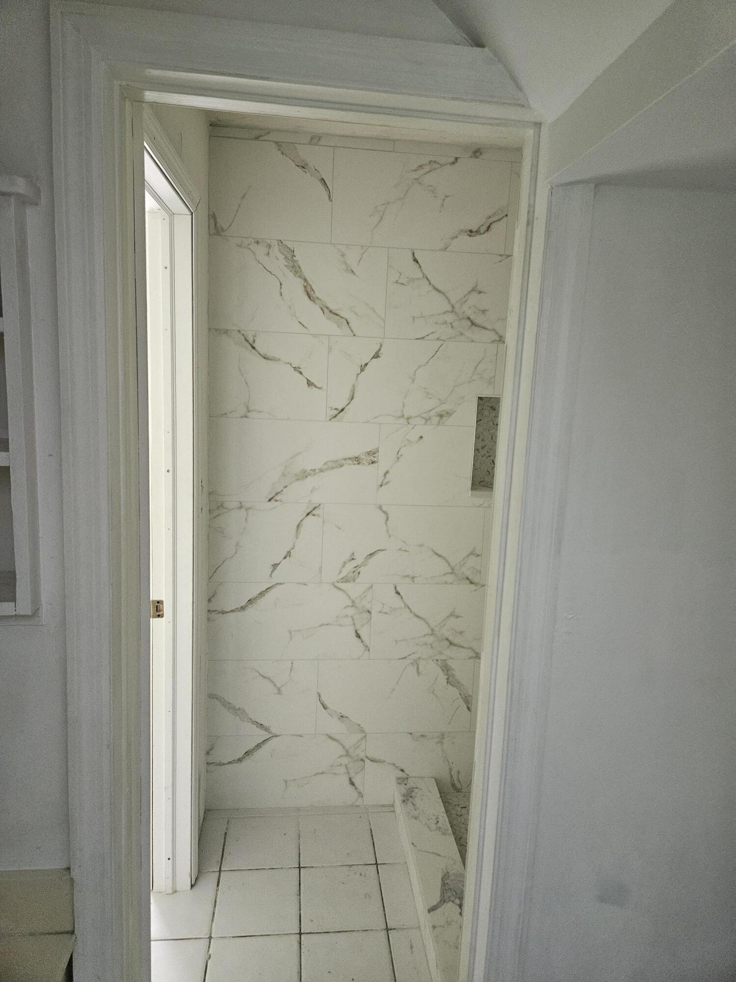 21109 Northeast 3rd Court Miami, FL 33179 - Photo 22 of 30 a bathroom with a shower