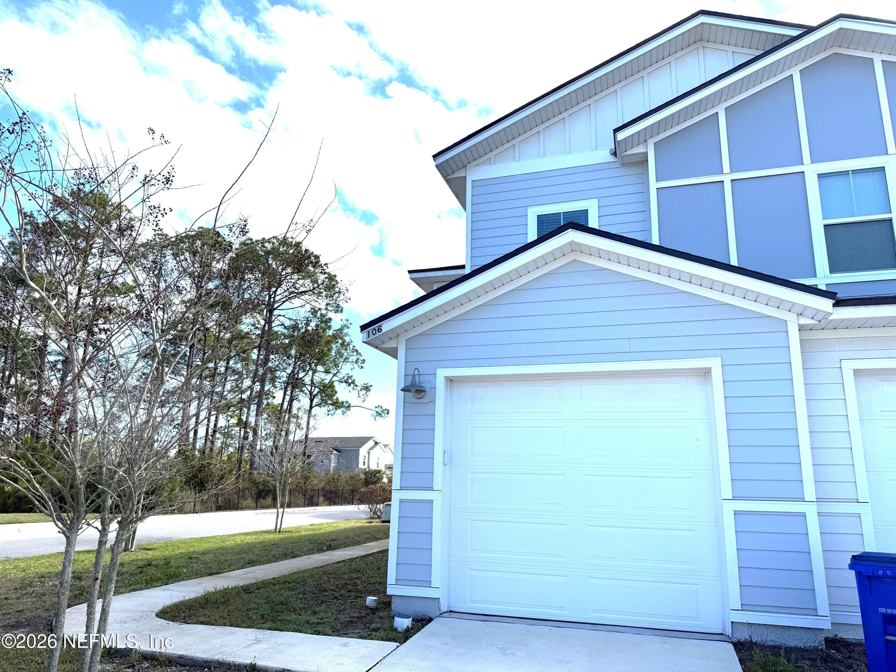 106 Ridge Lake Rd Street St. Augustine, FL 32086 - Photo 1 of 31 a view of a house with a yard