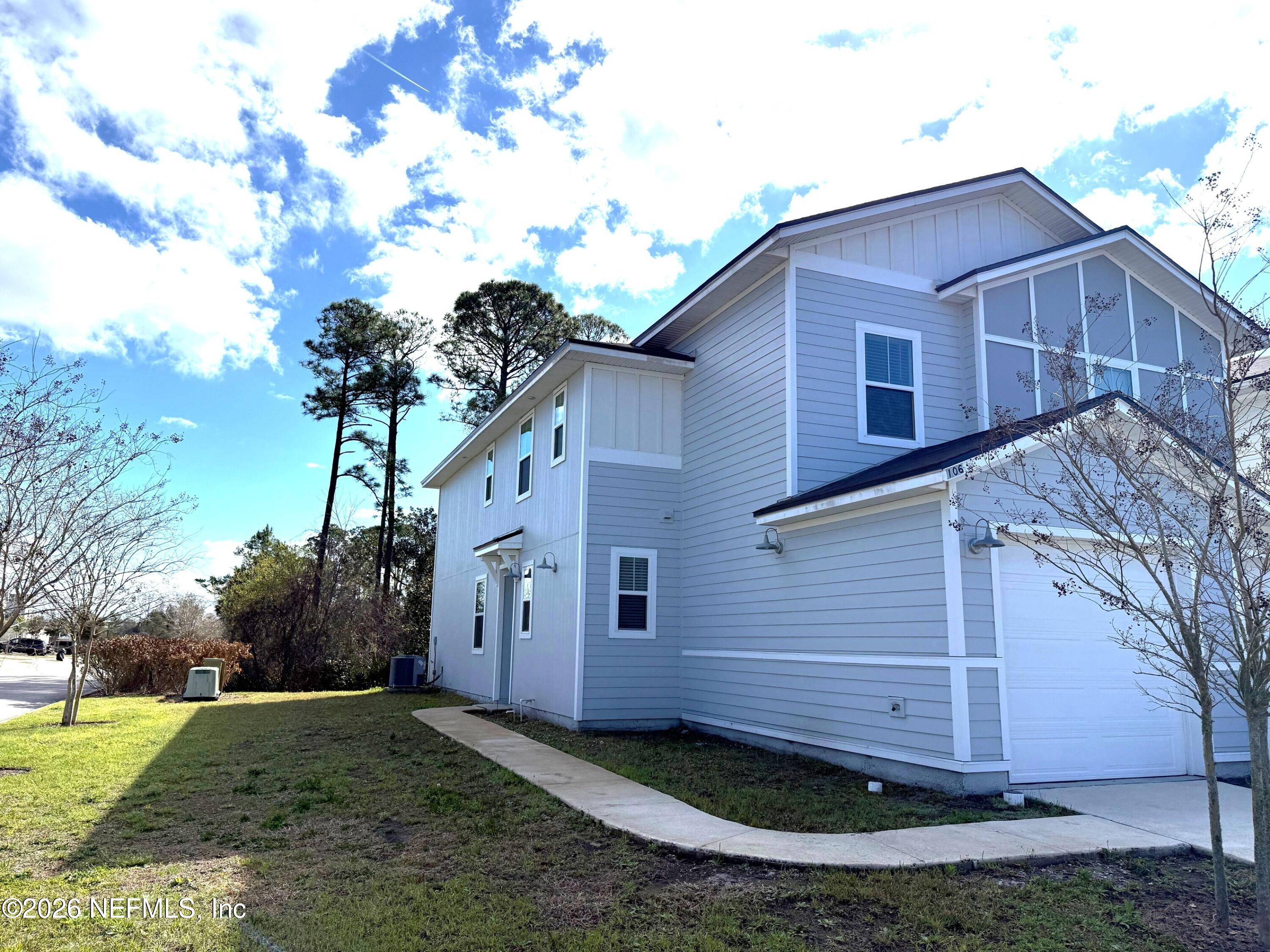 106 Ridge Lake Rd Street St. Augustine, FL 32086 - Photo 26 of 31 a view of a house with a yard