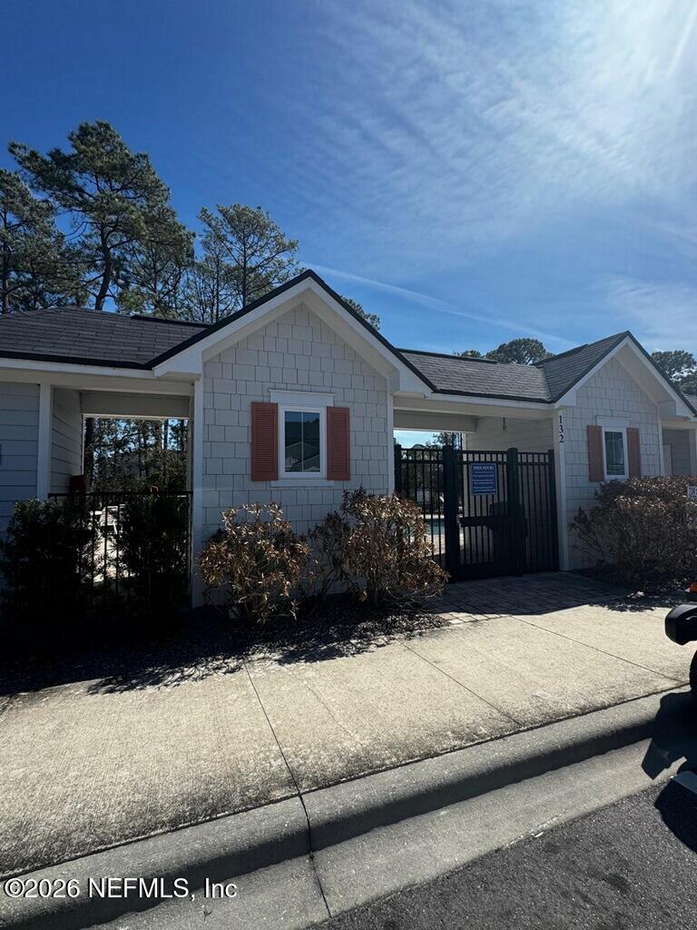 106 Ridge Lake Rd Street St. Augustine, FL 32086 - Photo 30 of 31 a front view of a house with a garden