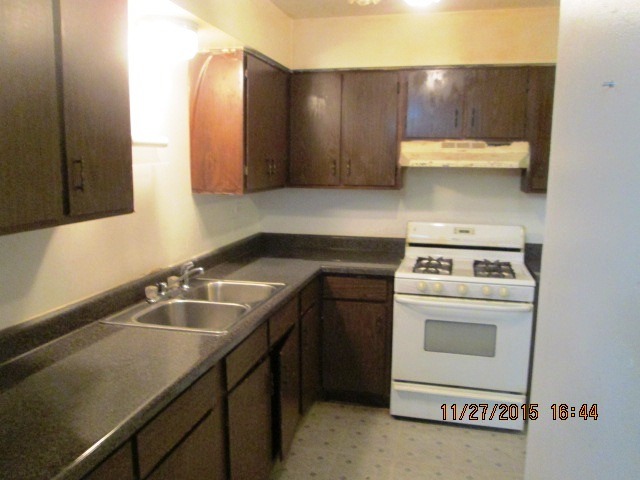 4809 West Engle Road, Unit 2B Alsip, IL 60803 - Photo 6 of 12 a kitchen with a sink cabinets and appliances