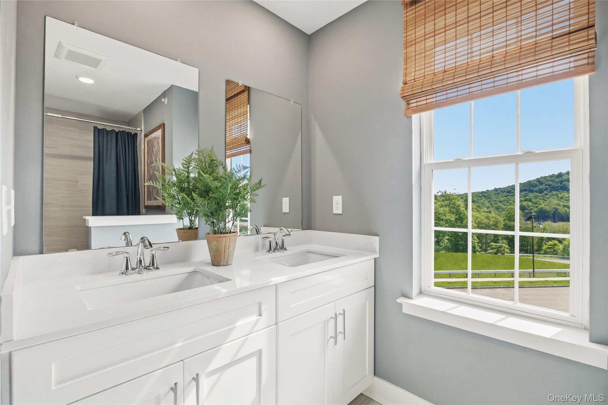 154 Pine Ridge Road Tuxedo Park, NY 10987 - Photo 18 of 25 a bathroom with a sink and a mirror