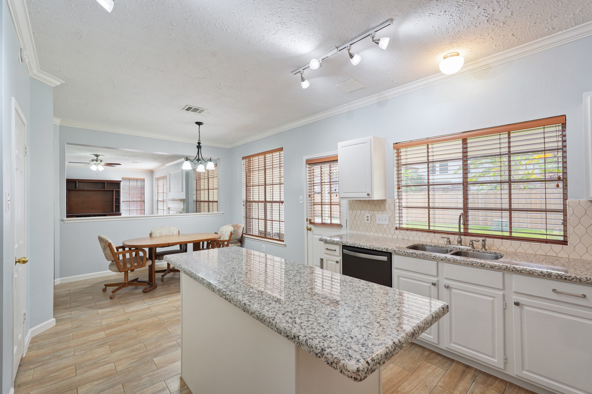 16215 Wemyss Bay Road Houston, TX 77095 - Photo 2 of 44 a large kitchen with kitchen island a large counter space and stainless steel appliances