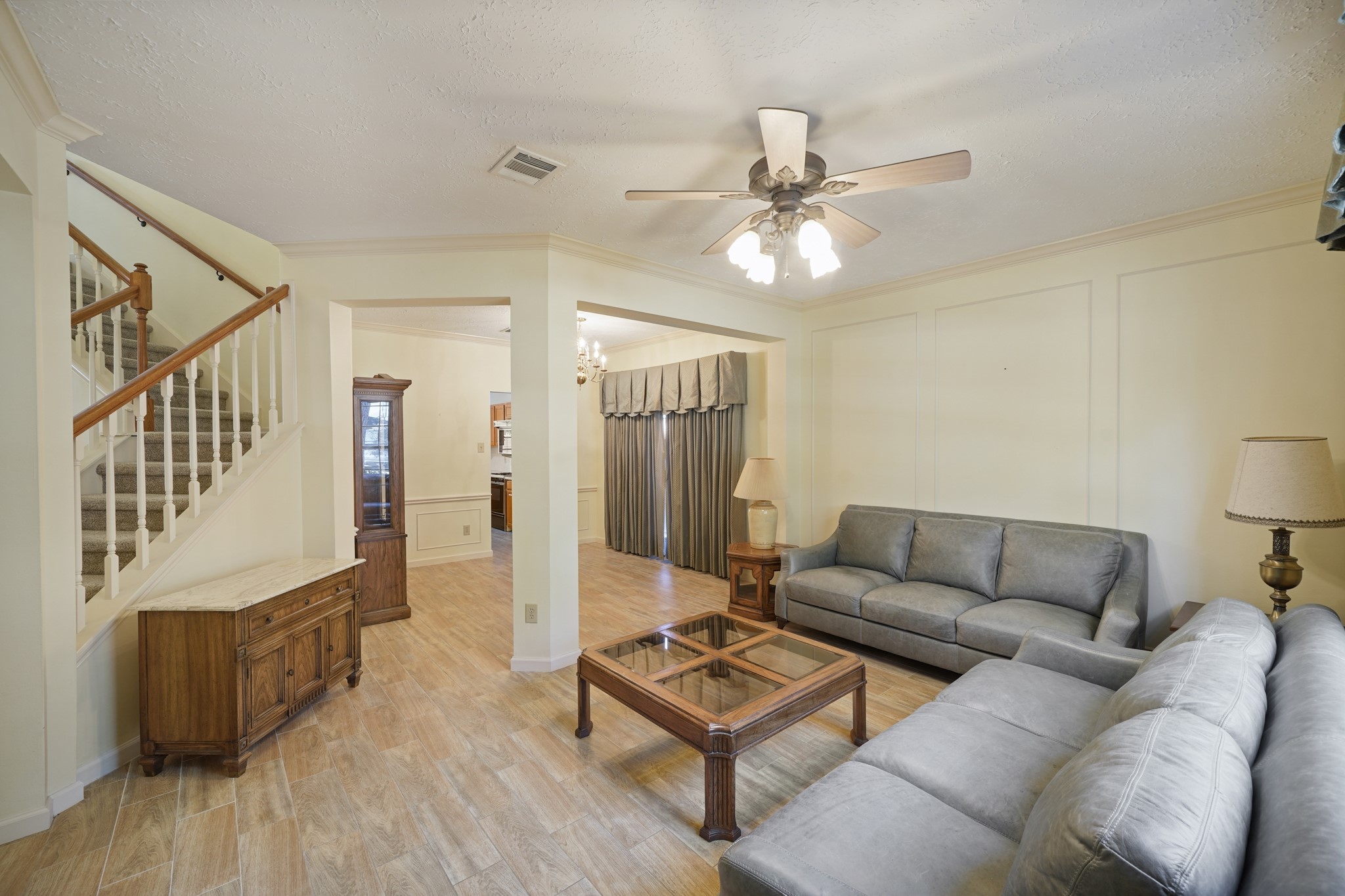 16215 Wemyss Bay Road Houston, TX 77095 - Photo 22 of 44 a living room with furniture and a ceiling fan