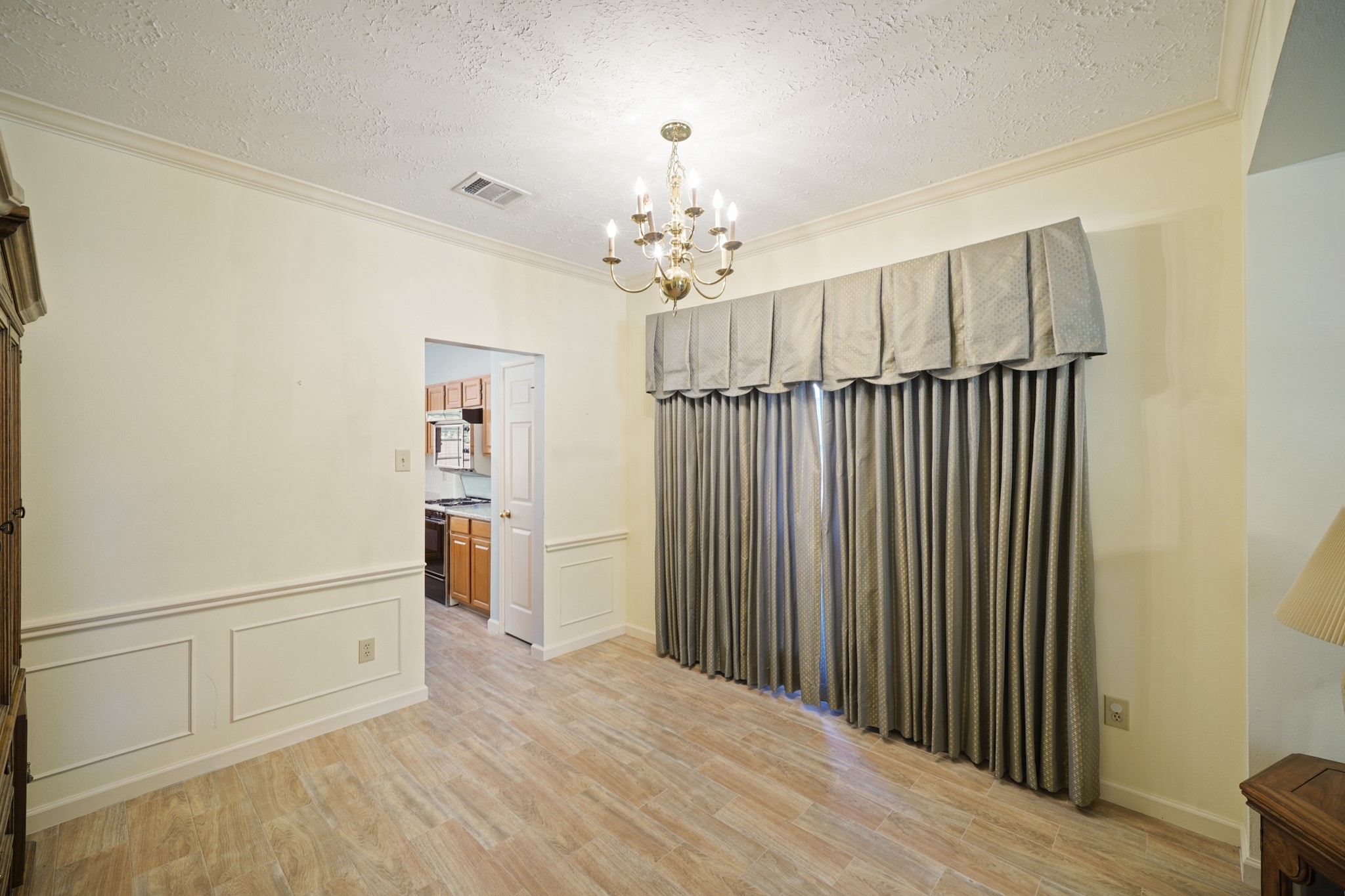 16215 Wemyss Bay Road Houston, TX 77095 - Photo 24 of 44 a view of a hallway with wooden floor and staircase