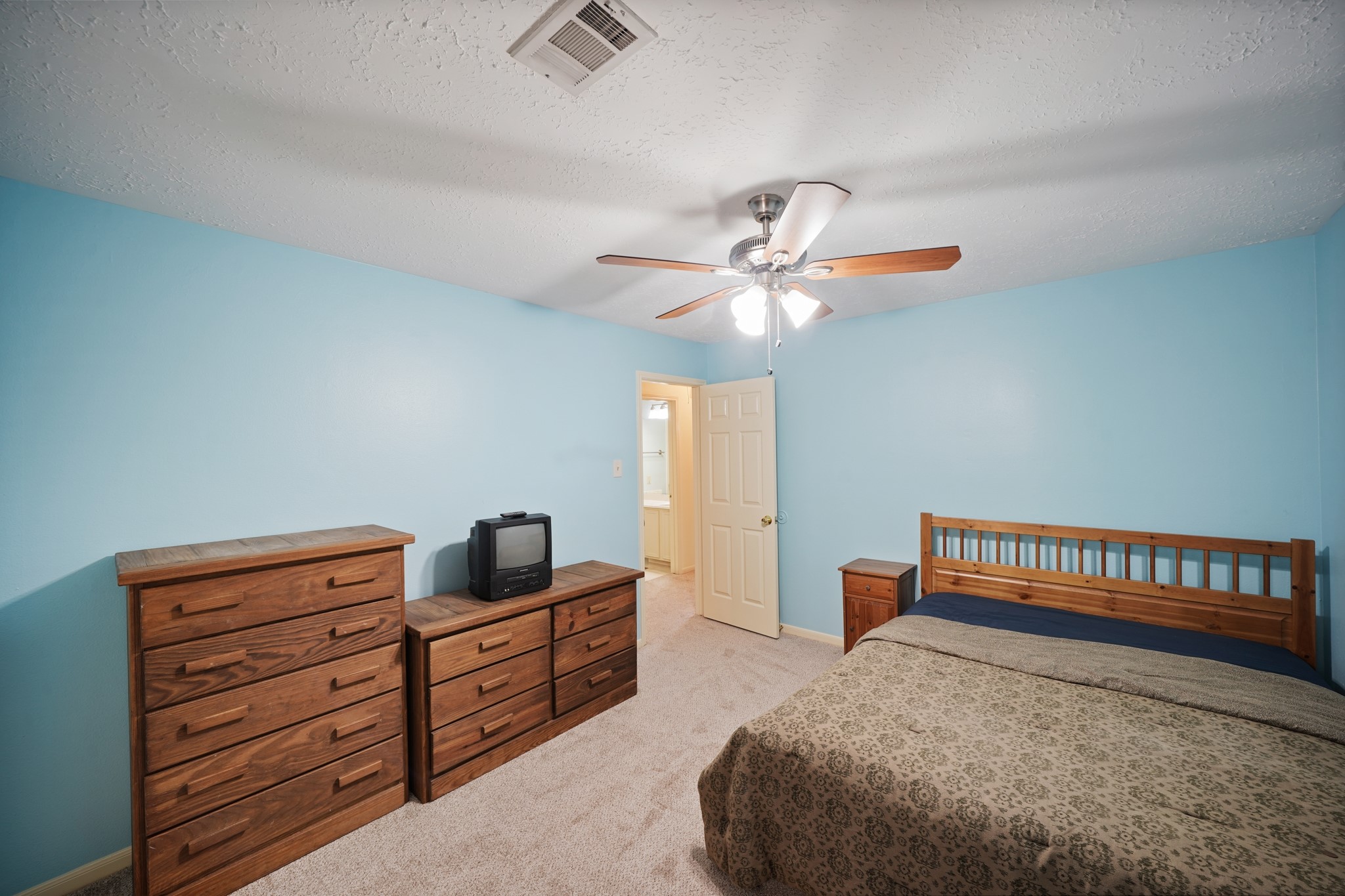 16215 Wemyss Bay Road Houston, TX 77095 - Photo 35 of 44 a bedroom with furniture and wooden floor