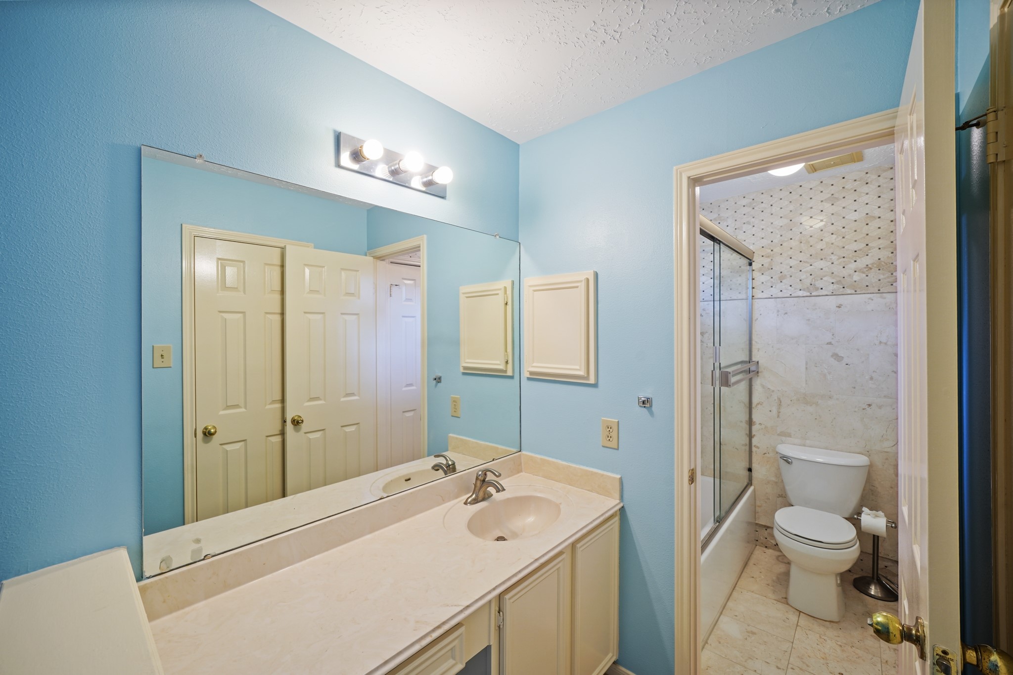 16215 Wemyss Bay Road Houston, TX 77095 - Photo 38 of 44 a bathroom with a sink a toilet and shower