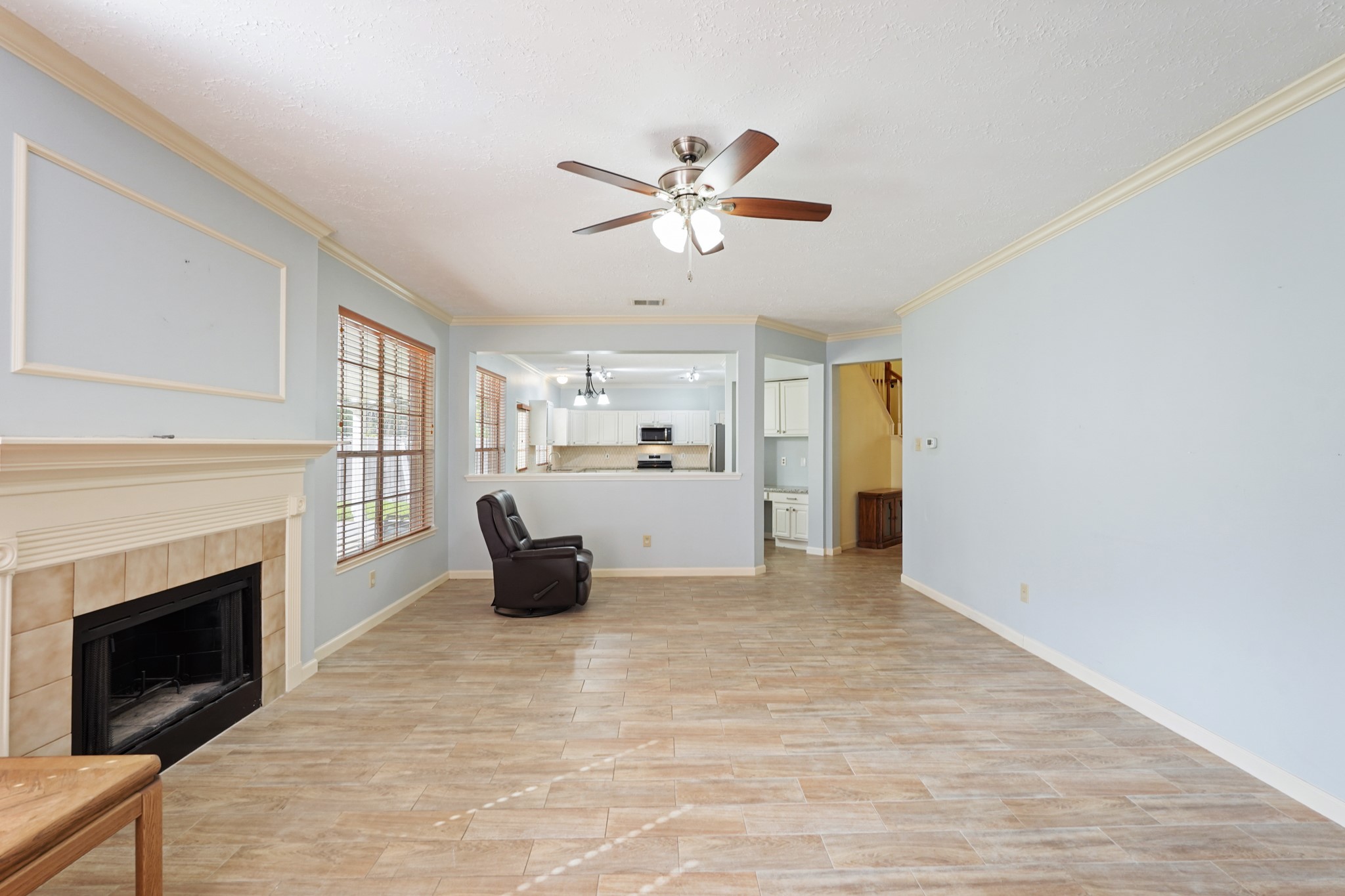 16215 Wemyss Bay Road Houston, TX 77095 - Photo 6 of 44 a living room with furniture and a fireplace