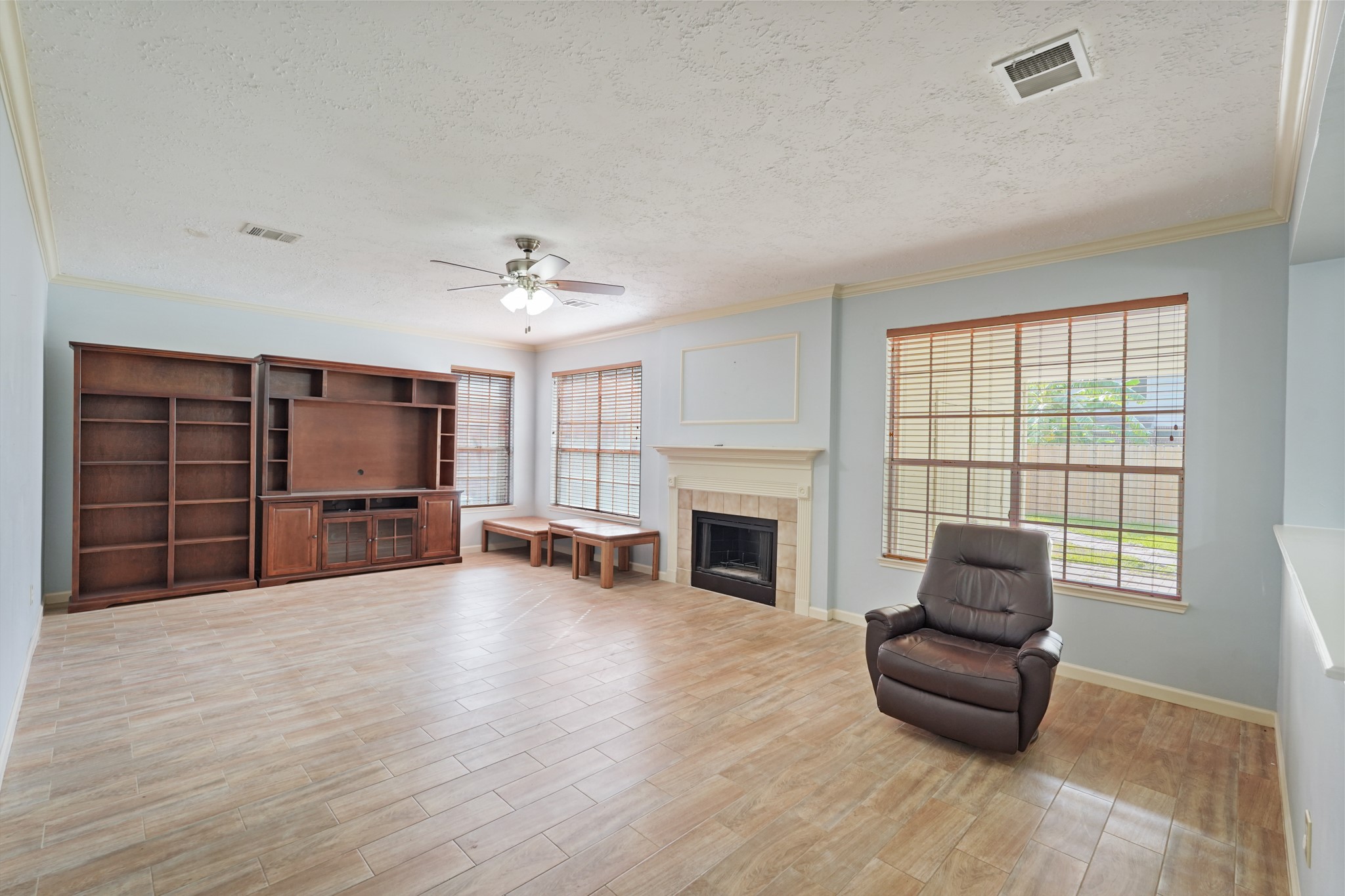 16215 Wemyss Bay Road Houston, TX 77095 - Photo 7 of 44 a living room with furniture and a fireplace