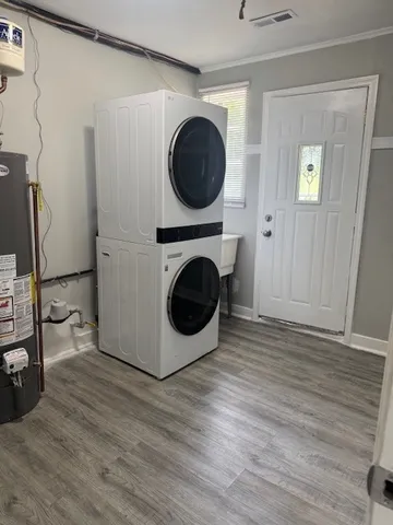 a view of a hallway with washer and dryer