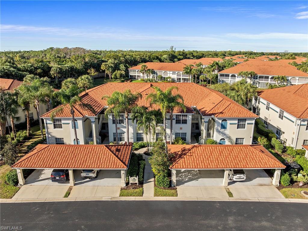 23810 Costa Del Sol Road, Unit 203 Estero, FL 34135 - Photo 1 of 48 Drone / aerial view