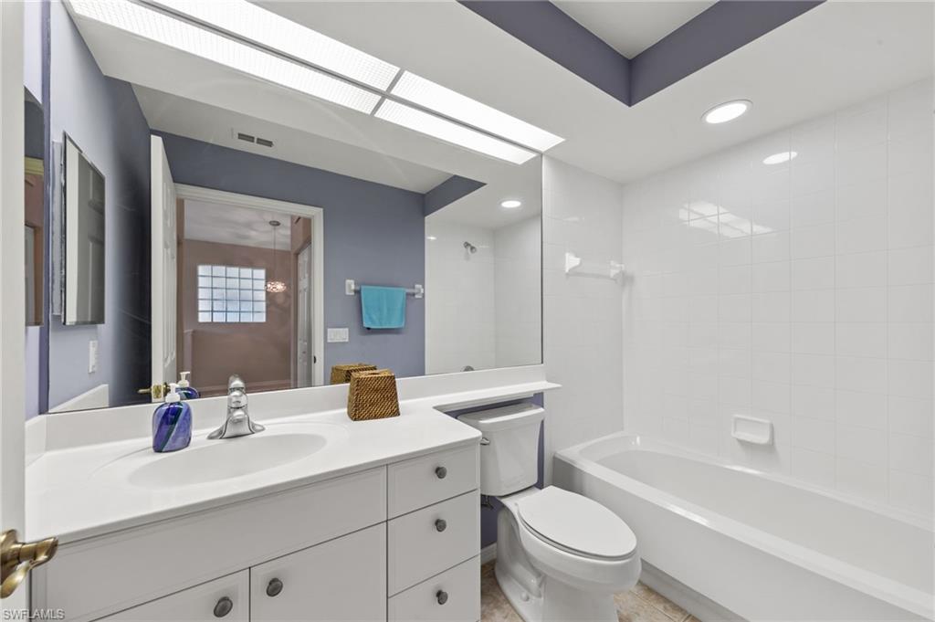 23810 Costa Del Sol Road, Unit 203 Estero, FL 34135 - Photo 20 of 48 Full bath with vanity, shower / washtub combination, and recessed lighting