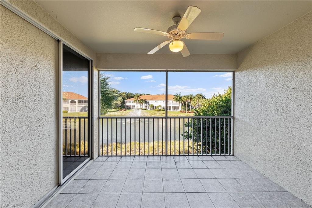 23810 Costa Del Sol Road, Unit 203 Estero, FL 34135 - Photo 26 of 48 Unfurnished sunroom featuring a ceiling fan, a balcony, and a residential view