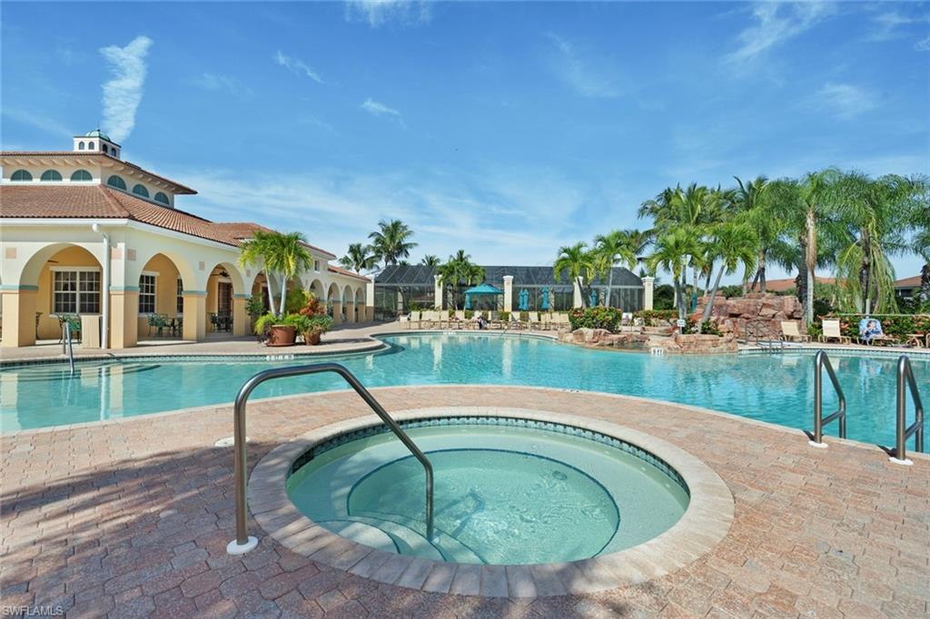 23810 Costa Del Sol Road, Unit 203 Estero, FL 34135 - Photo 40 of 48 Community pool with a patio and a community hot tub