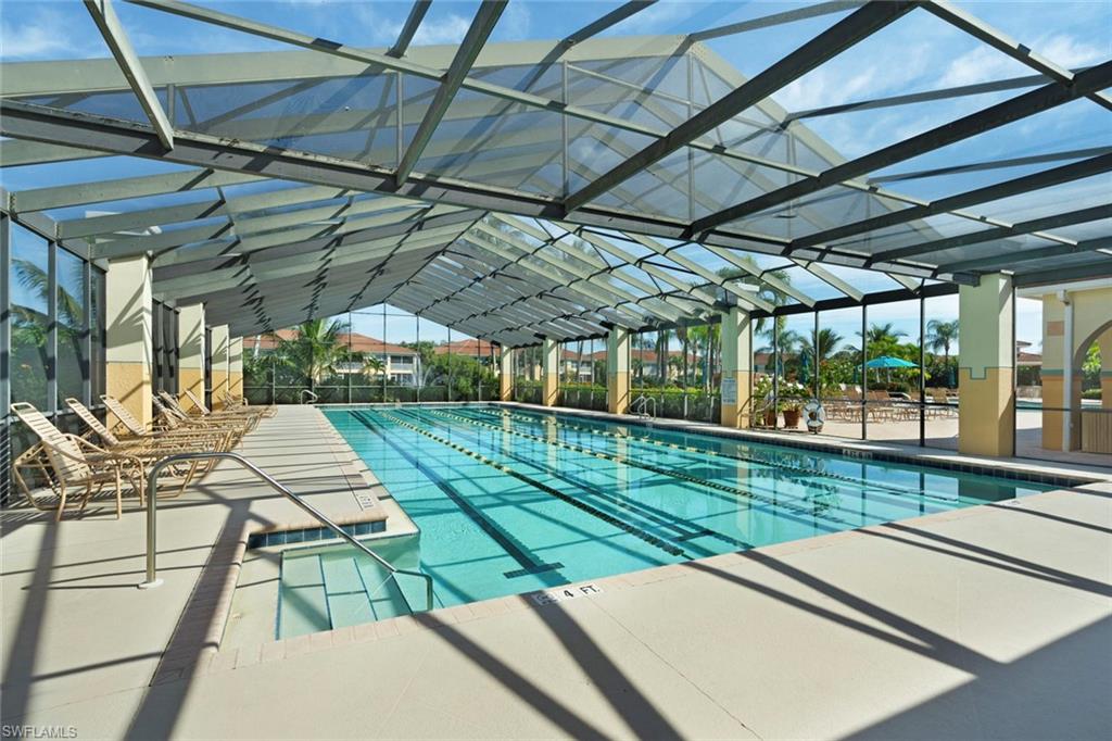 23810 Costa Del Sol Road, Unit 203 Estero, FL 34135 - Photo 41 of 48 Community pool featuring a patio area and a lanai