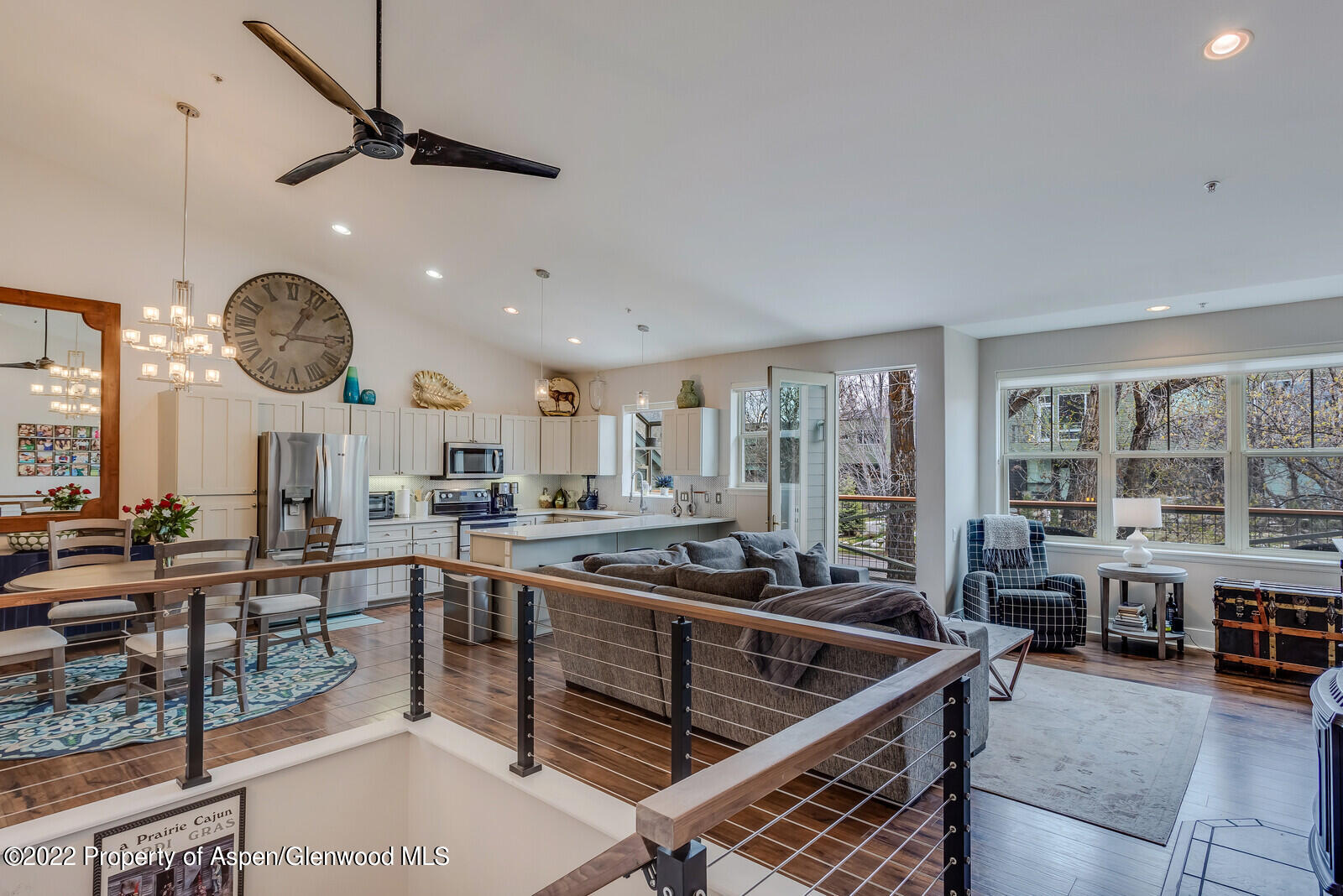 a kitchen with lots of counter space furniture and a large window