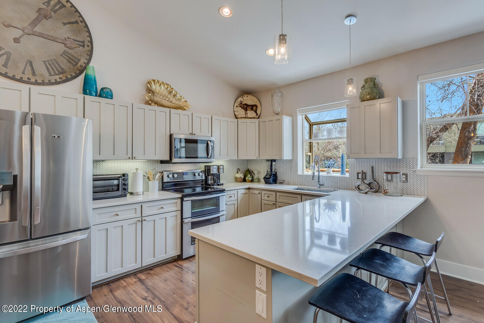 712 Evans Court Basalt, CO 81621 - Photo 11 of 29 a large kitchen with cabinets and stainless steel appliances
