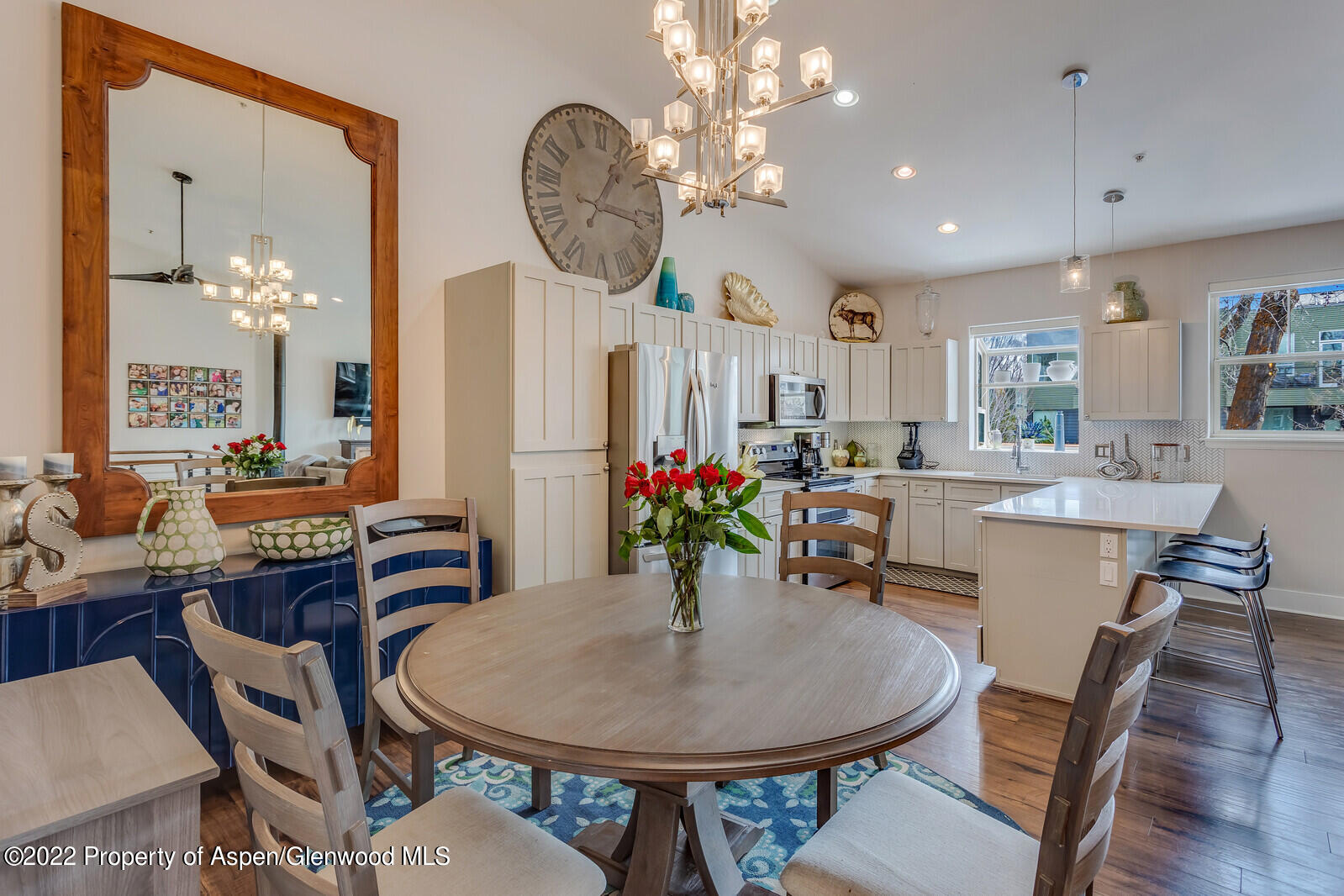 712 Evans Court Basalt, CO 81621 - Photo 12 of 29 a view of a dining room with furniture a chandelier and wooden floor