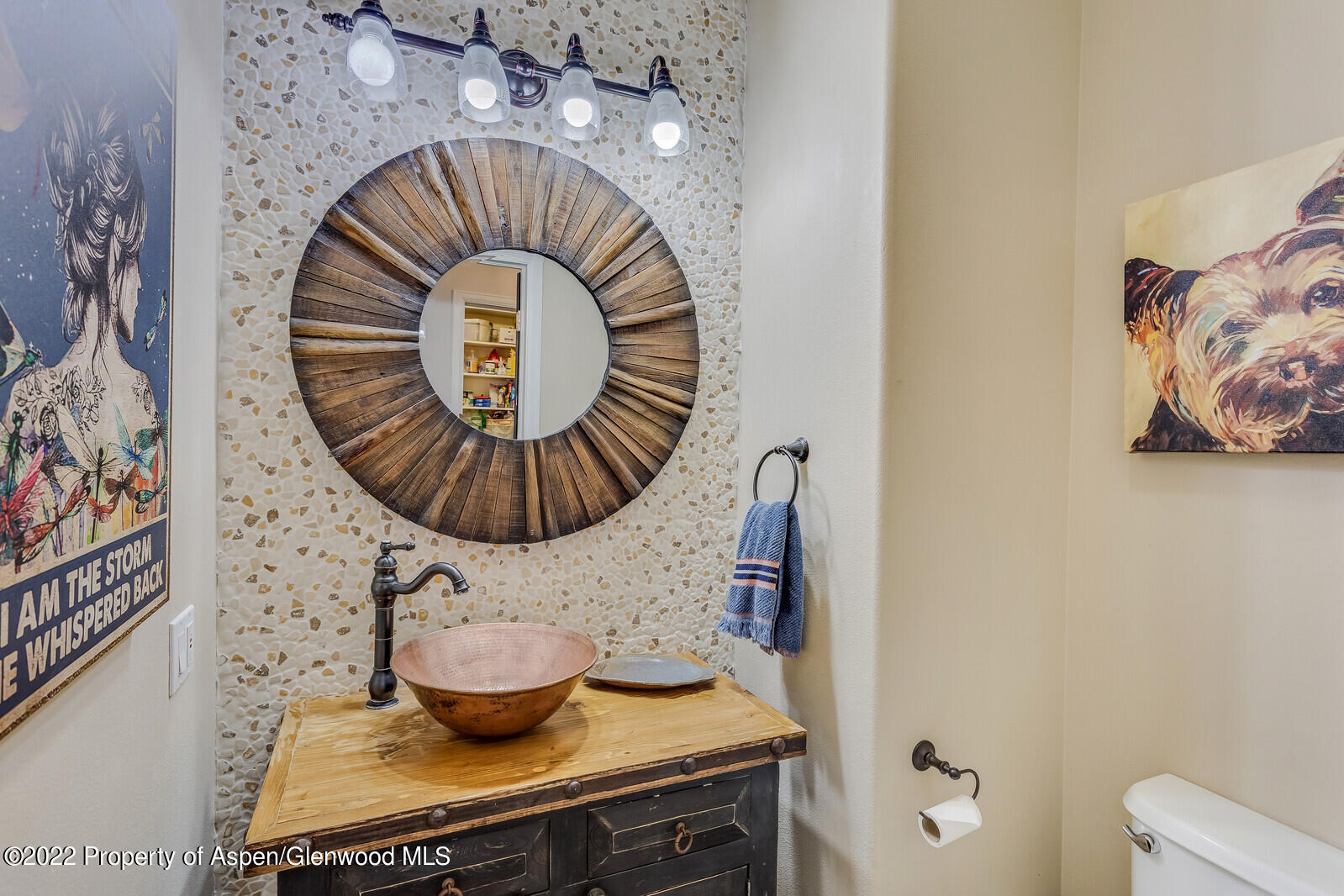 712 Evans Court Basalt, CO 81621 - Photo 19 of 29 a kitchen with a stove and a painting on the wall