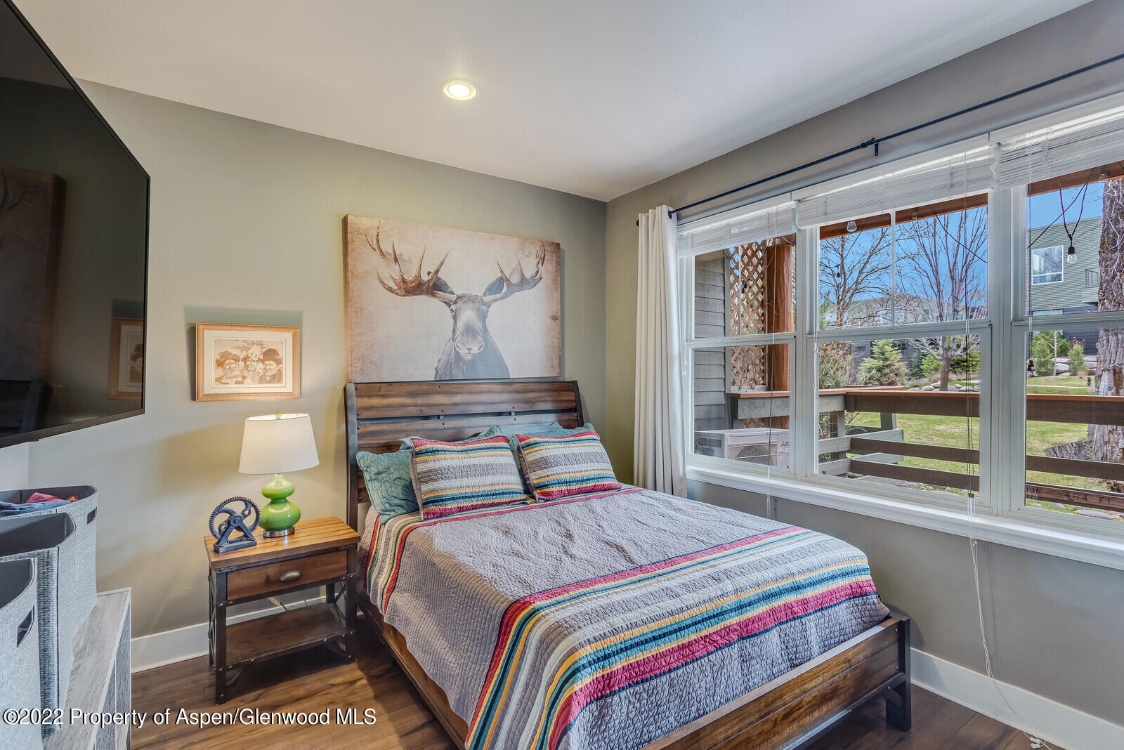 712 Evans Court Basalt, CO 81621 - Photo 27 of 29 a bedroom with a bed and a large window
