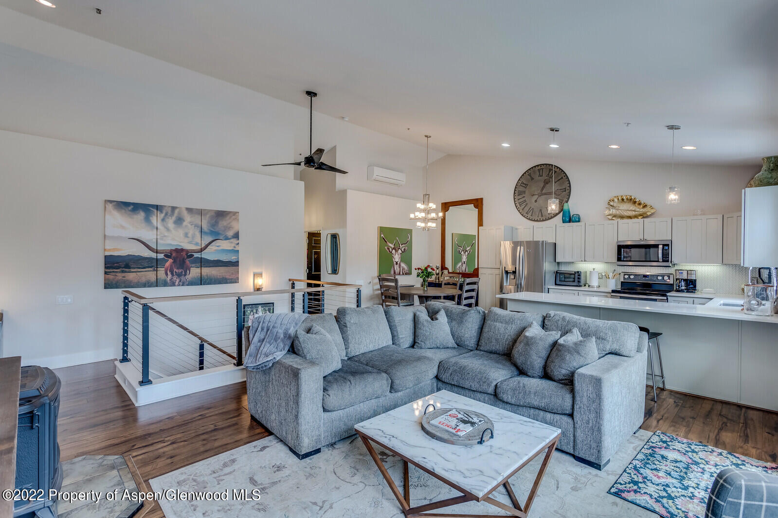 712 Evans Court Basalt, CO 81621 - Photo 8 of 29 a living room with furniture kitchen view and a clock