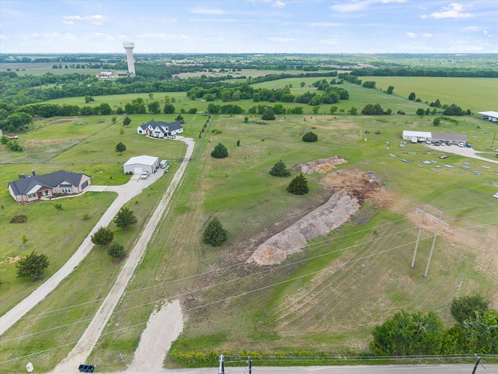 1259 Willy Vester Road Van Alstyne, TX 75495 - Photo 2 of 10 a view of a lake with a yard