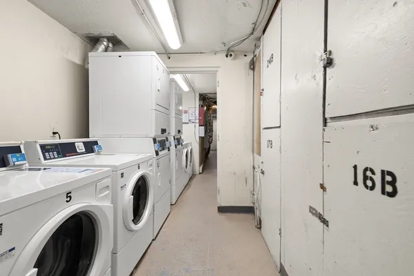 a view of swimming pool with outdoor seating and covered with trees