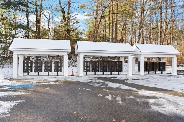 a view of wooden fence next to a building