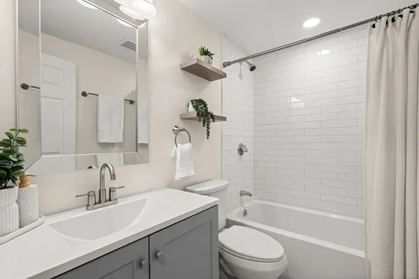 a view of a house with a snow in the yard