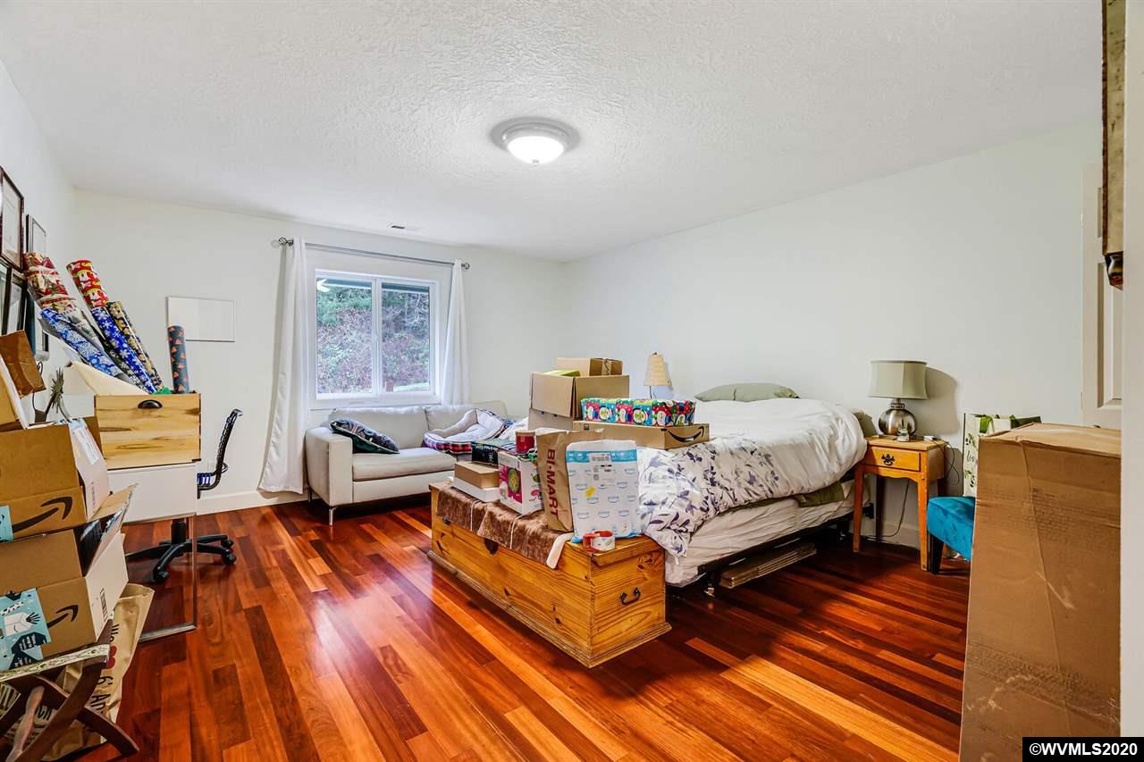 2065 Southeast Godsey Road Dallas, OR 97338 - Photo 31 of 34 a bed room with a bed and wooden floor