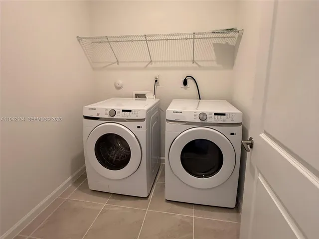 a utility room with dryer and washer
