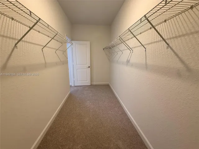 a view of a room with racks on the wall