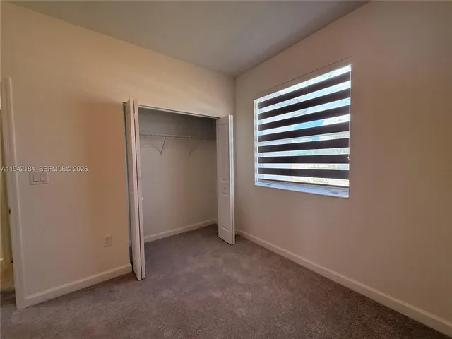 a view of kitchen and hallway