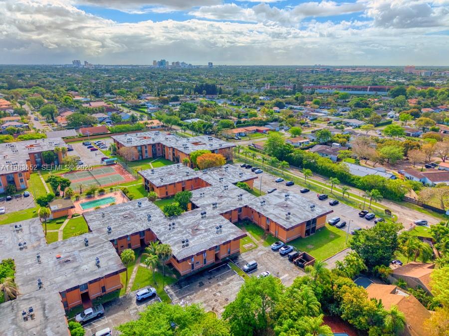 9459 Southwest 76th Street, Unit R5 Miami, FL 33173 - Photo 23 of 33 an aerial view of residential houses with outdoor space
