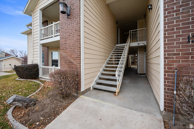 2095 South Main Street, Unit 13 Bountiful, UT 84010 - Photo 4 of 45 View of exterior entry featuring brick siding