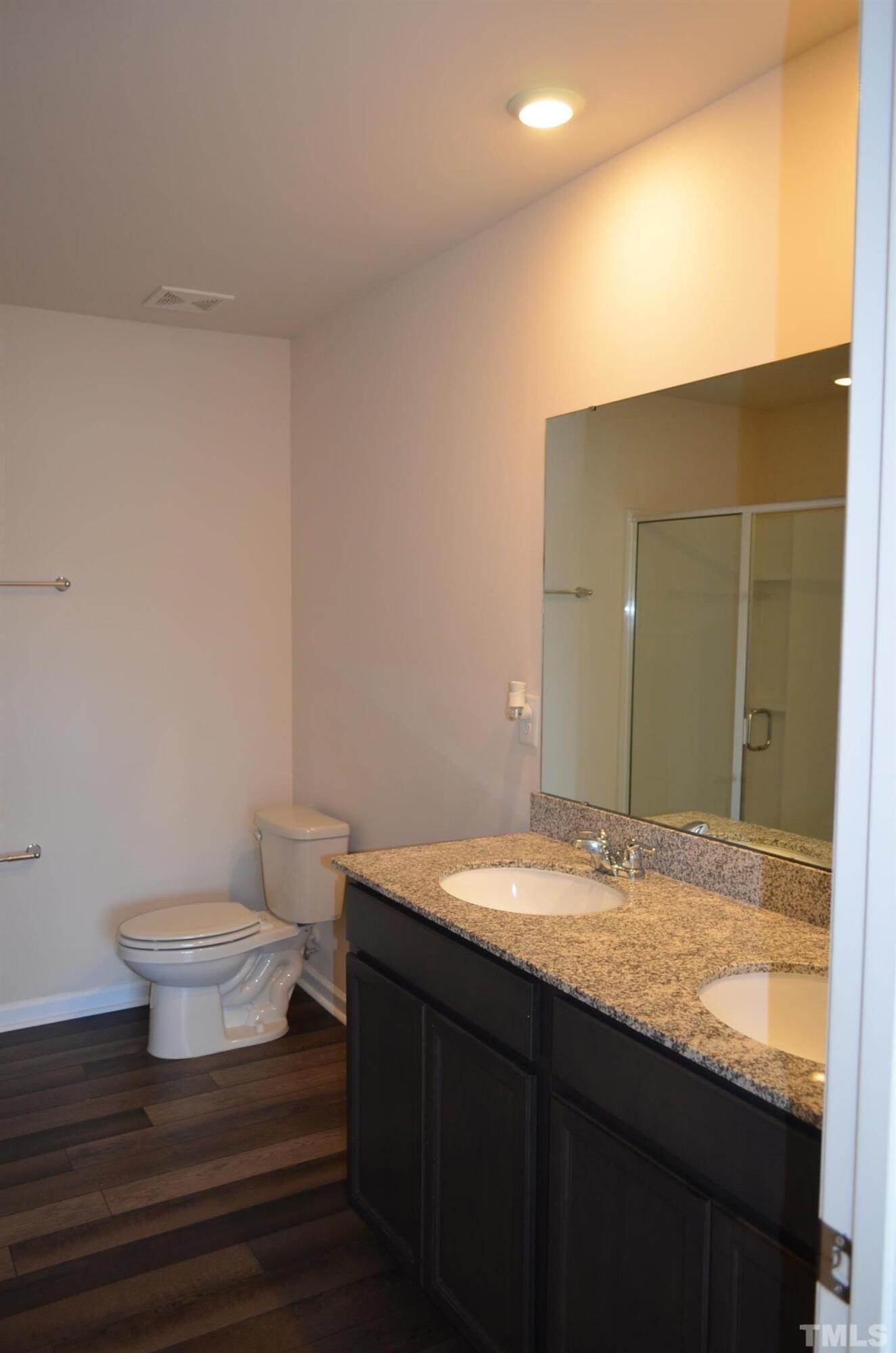 3537 Pinnacle Peak Drive Raleigh, NC 27604 - Photo 26 of 41 a bathroom with a granite countertop sink and a mirror