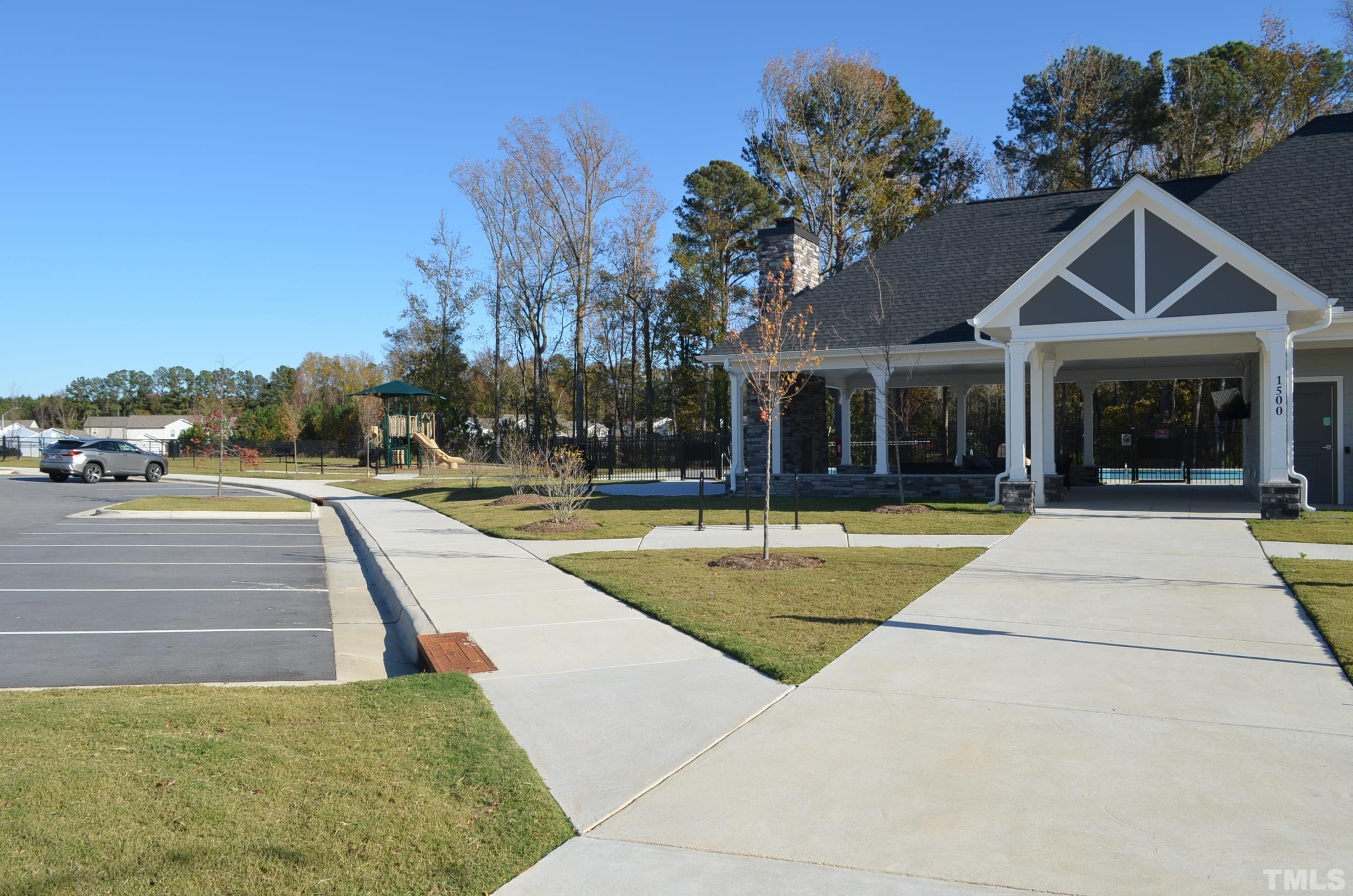 3537 Pinnacle Peak Drive Raleigh, NC 27604 - Photo 41 of 41 a view of a white house with palm trees in front of it