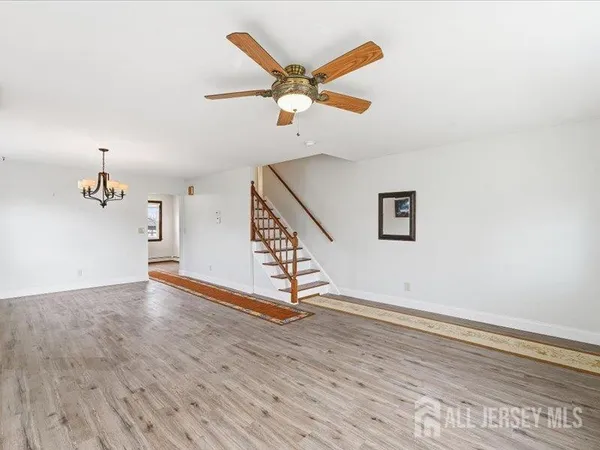 a view of an entryway with wooden floor