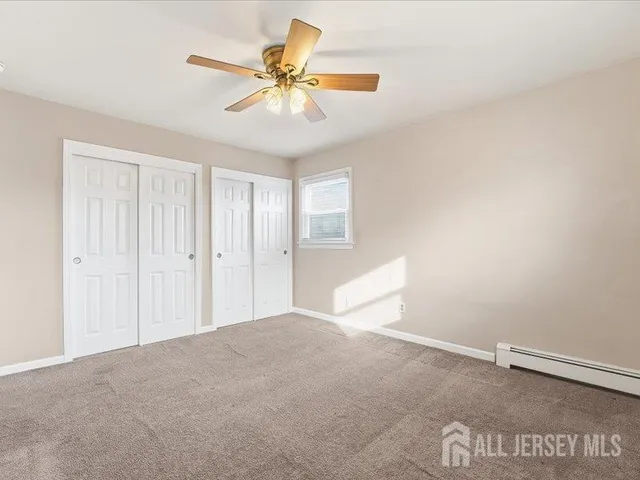 a view of a livingroom with a ceiling fan