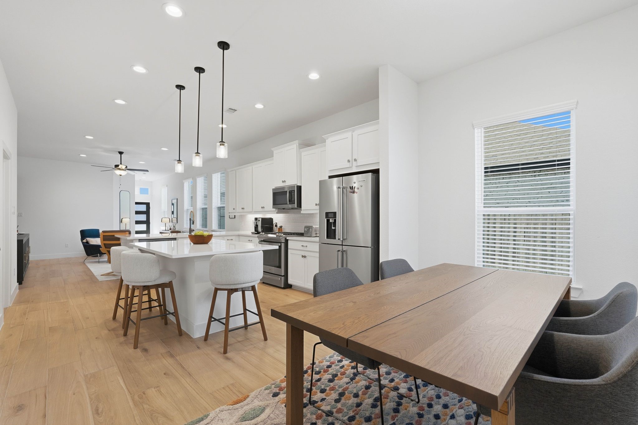17907 Purple Amaranth Conroe, TX 77385 - Photo 15 of 30 a dining room with stainless steel appliances kitchen island granite countertop a dining table chairs and a refrigerator